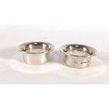 A pair of silver tealight holders of plain circular form, maker PS, London 1977, d. 5.