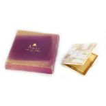 A boxed Asprey mother-of-pearl and gilt metal compact,