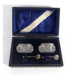 A cased pair of Edwardian silver mounted cut glass salts and spoons, maker GEW,