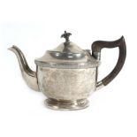 An early 20th century silver teapot of squat form decorated in the Neo-Classical manner, maker EV,