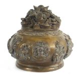 A Chinese cast metal covered koro of circular squat form, the cover decorated with sycee,