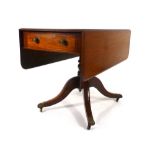 A 19th century mahogany Pembroke table with a single frieze drawer on four splayed legs with brass