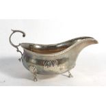 An early 20th century American metalware cream jug of typical form with beaded border, Shreeve,