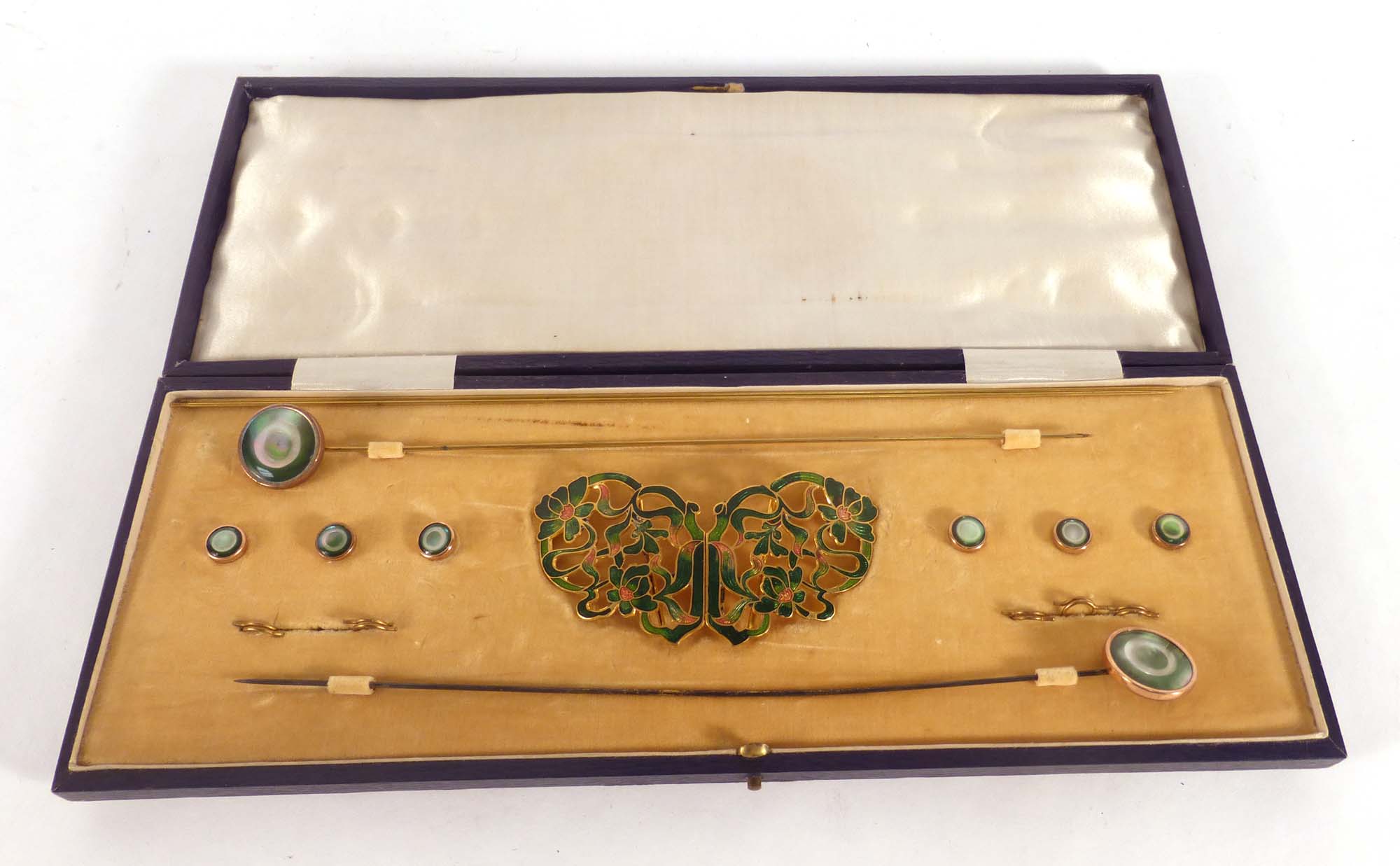 A cased gilt metal and green enamelled dress set comprising a buckle,