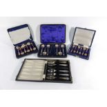 A cased set of six silver seal end teaspoons and a pair of nips,