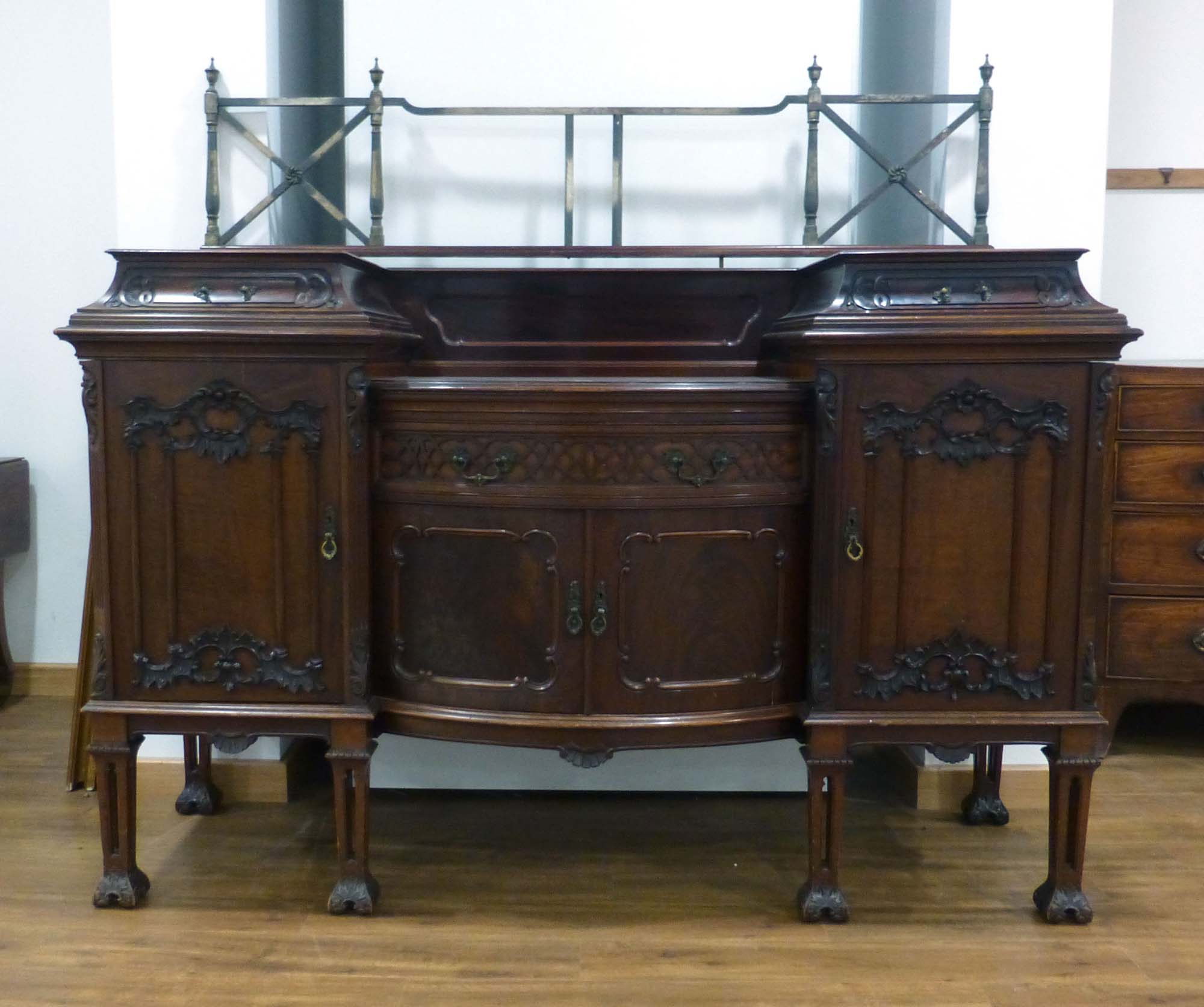 A Victorian mahogany sideboard with an arrangement of three drawers and four drawers below a brass