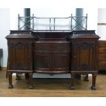 A Victorian mahogany sideboard with an arrangement of three drawers and four drawers below a brass