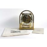 A Kieninger mantel clock, the silvered dial with Roman numerals,