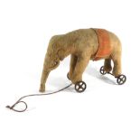 A stuffed felt pull along elephant in the manner of Steiff, h.