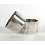 A silver napkin ring of octagonal form and a plated example (2)