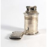 A silver mounted table lighter of cylindrical form and a silver florally engraved vesta case,