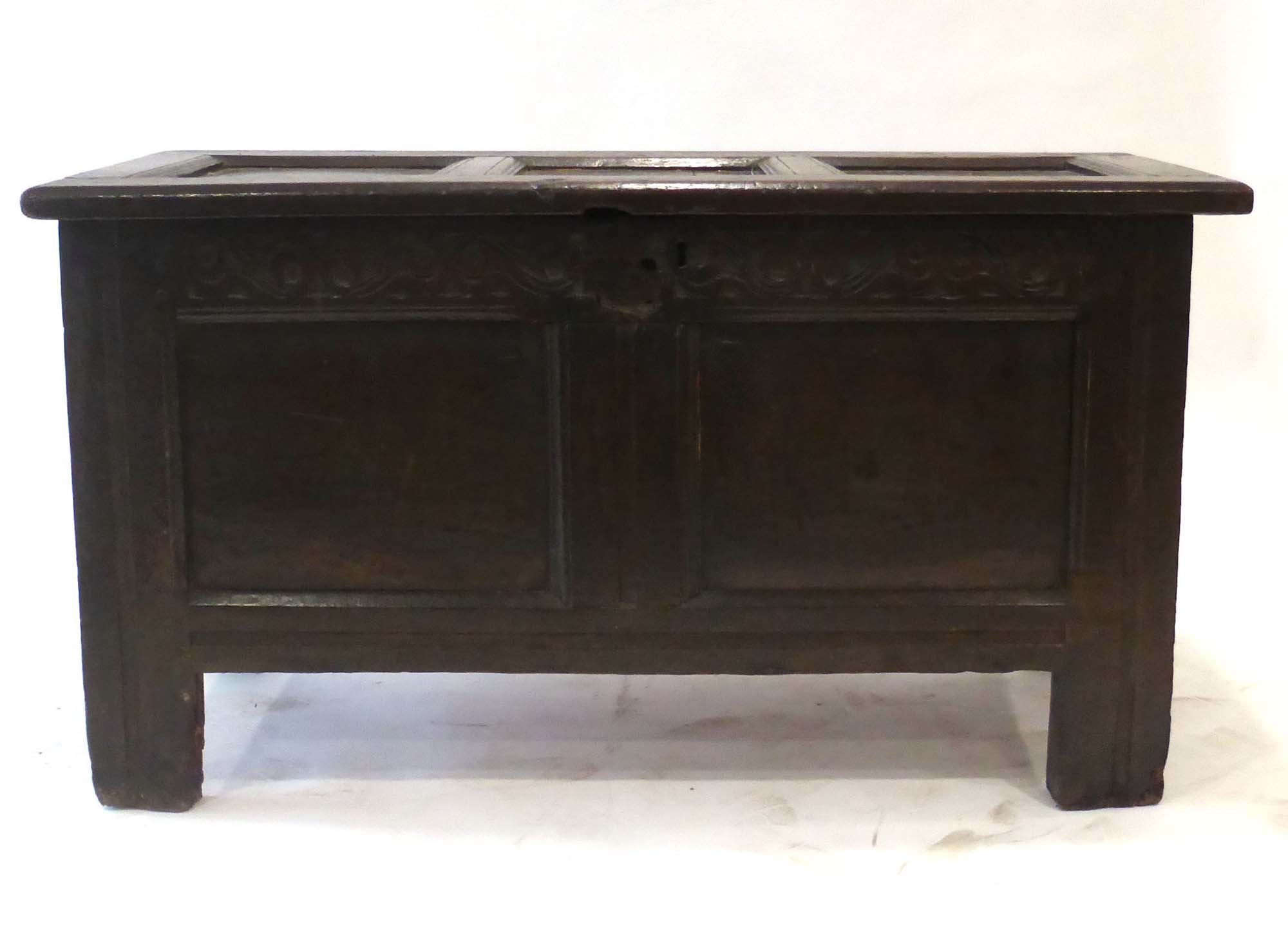 A 17th century oak panelled coffer on square straight stiles, l.