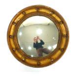 A 19th century giltwood and plaster cavetto circular wall mirror, d.