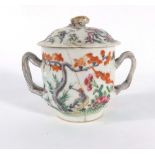 A Cantonese two handled vase and cover typically decorated in coloured enamels with birds amongst