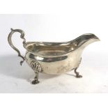 An early 20th century silver gravy boat of typical form with gadrooned border, maker JD WD,