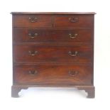 A George III mahogany and crossbanded chest of two short over three long drawers on bracket feet, w.