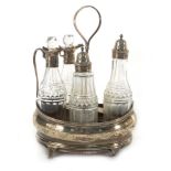 A George III silver five bottle condiments stand of oval form on four outswept feet, Peter,