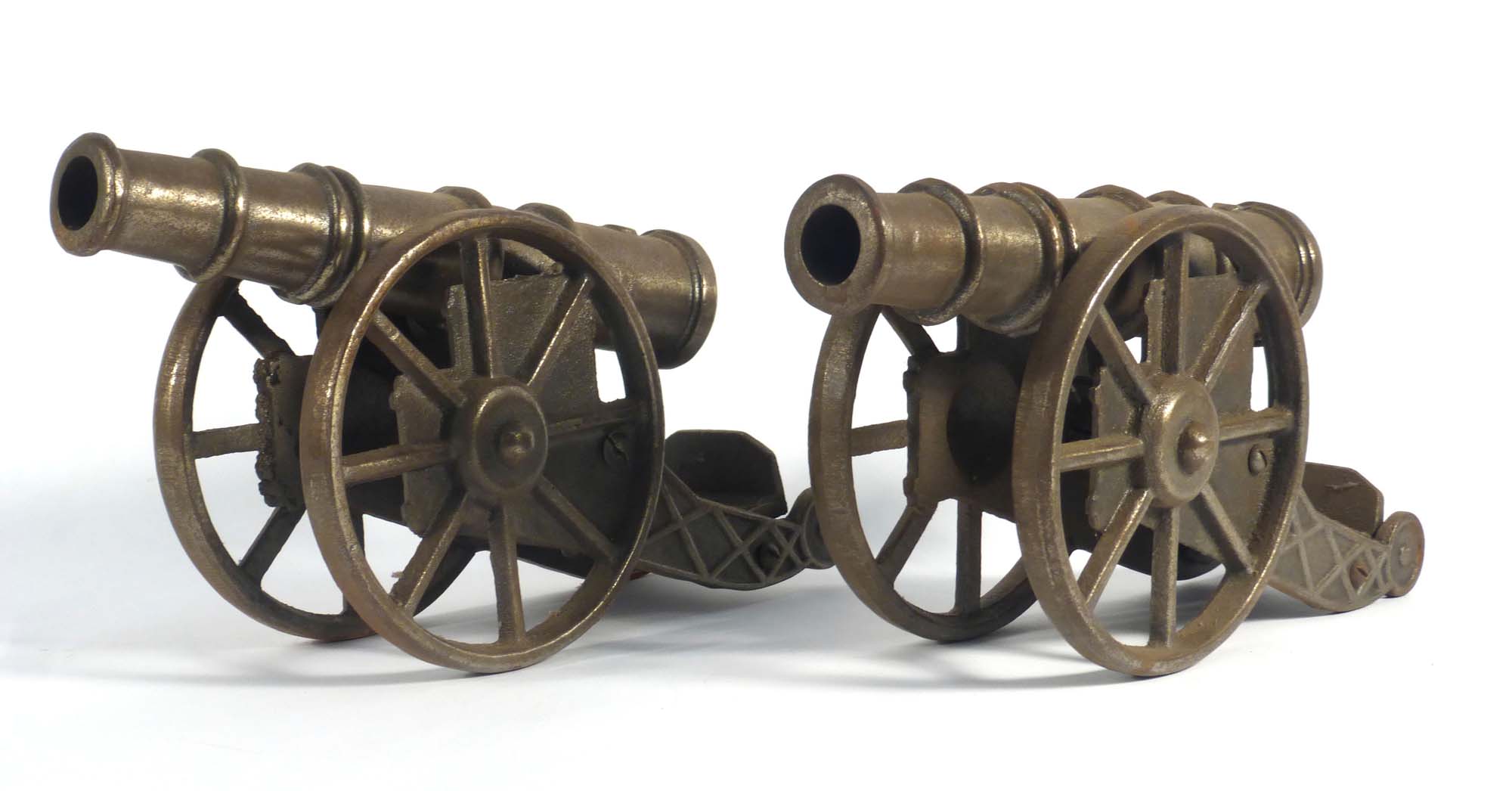 A pair of cast metal ornaments modelled as field cannon, registration 889867, l.