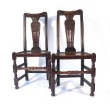 A pair of 18th century oak and ash side chairs,