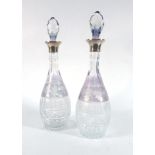 A pair of etched and cut glass decanters and stoppers of slender ovoid form,