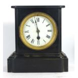 A Victorian mantle timepiece, the enamelled face with Roman numerals,