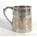 An Edwardian silver Christening mug of banded tapered cylindrical form, A F Bros.
