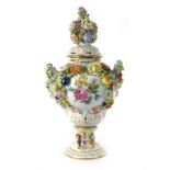 A 19th century Continental florally encrusted twin-handled pot pourri vase and cover, h.