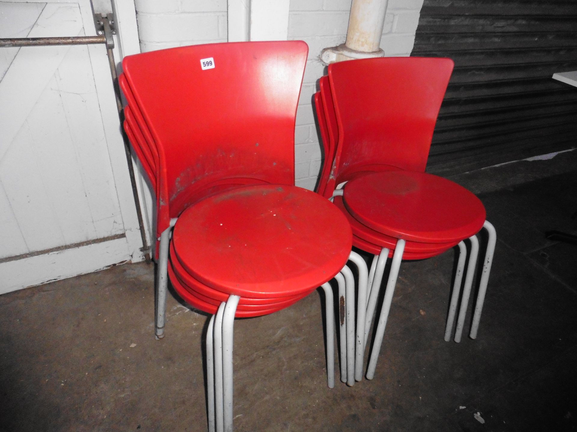 Stack of 7 Olaf Von Bohr designer stacking chairs, in red