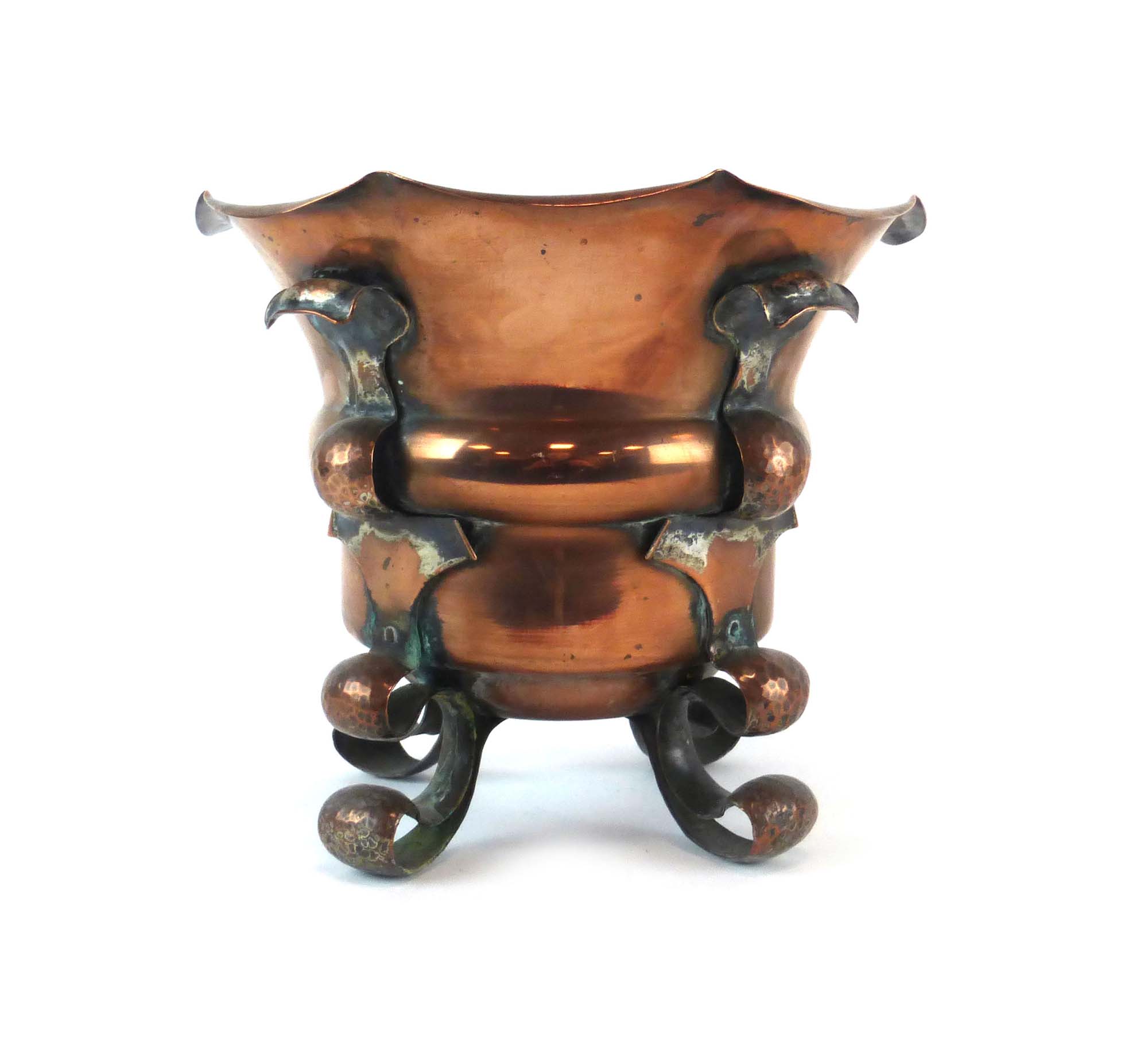 An Arts & Crafts copper jardiniere, the handles of beaten form, the base stamped 'S S, HB', h.