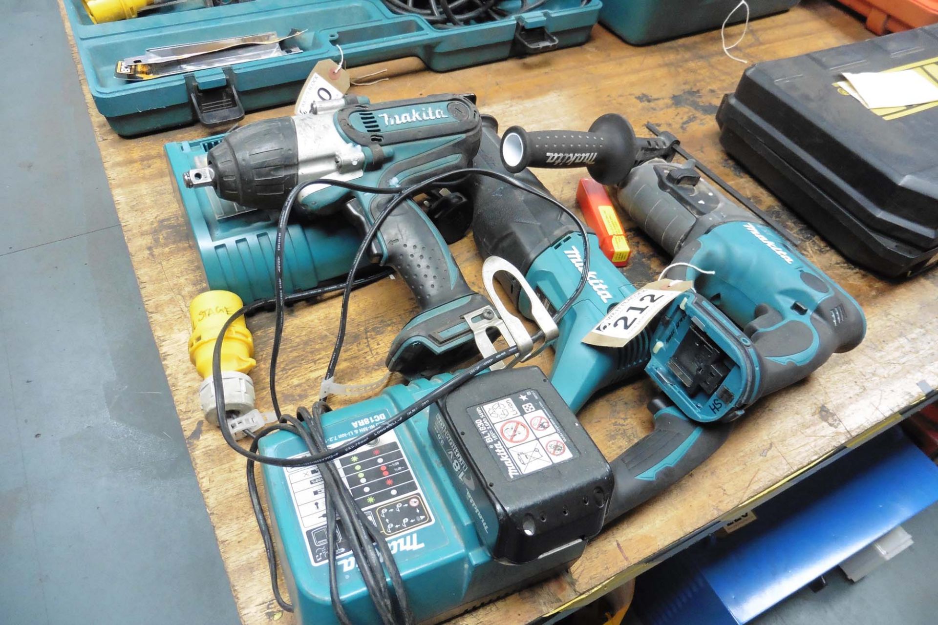 Qty of Makita battery tools, with 1 battery, 2 chargers, wrench, reciprocating saw and hammer drill