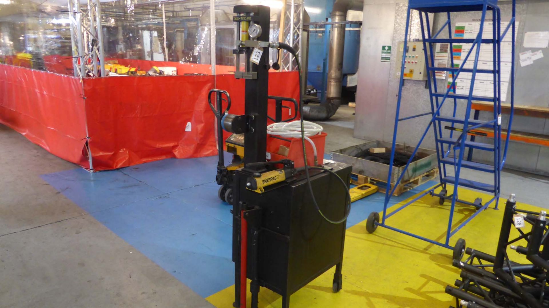 Load test rig comprising Enerpac 800psi manual hydraulic ram set and gauge with mobile cabinet and