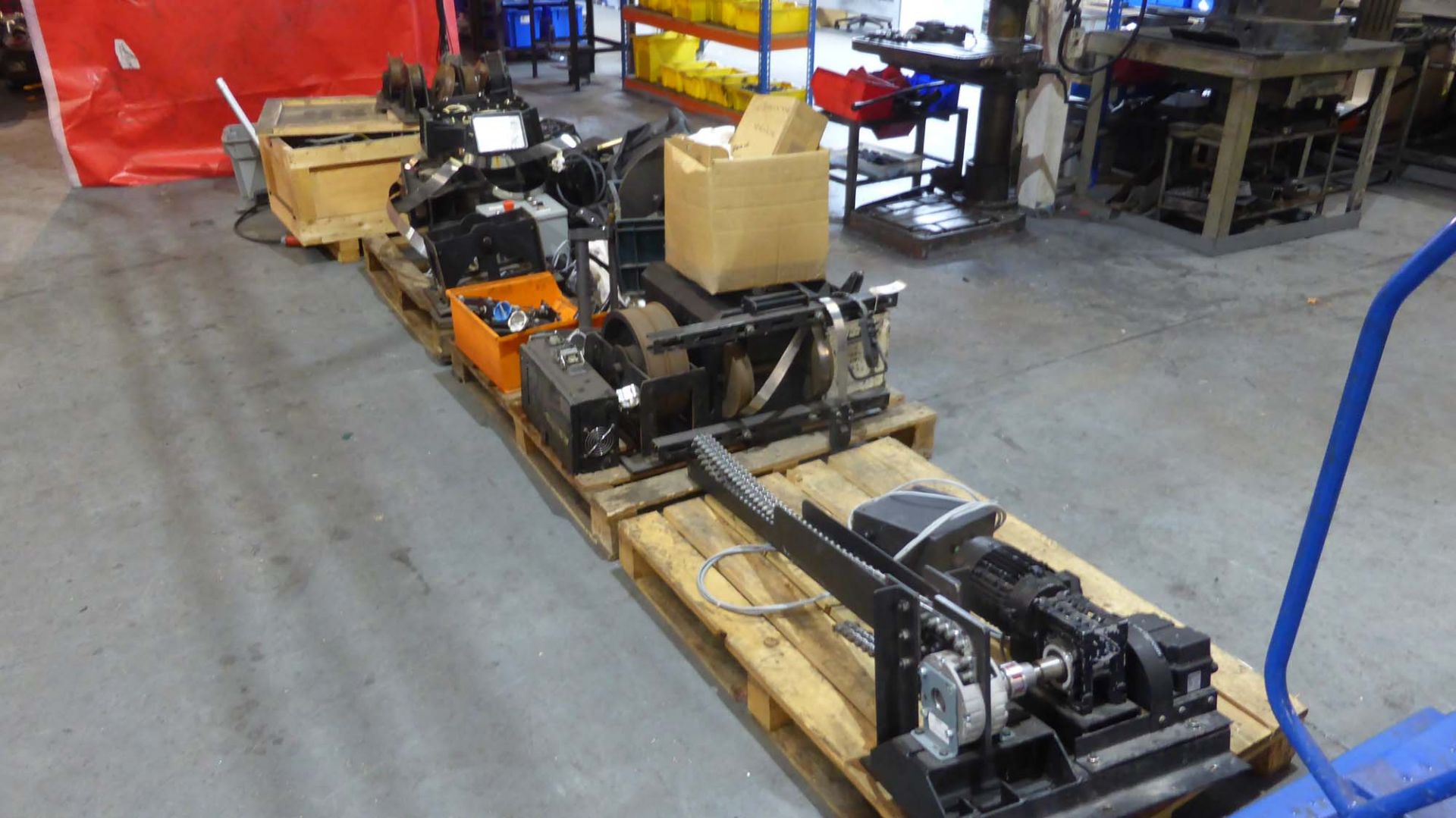 4 pallets of assorted second hand cinema track components including winching units, gear box motors,