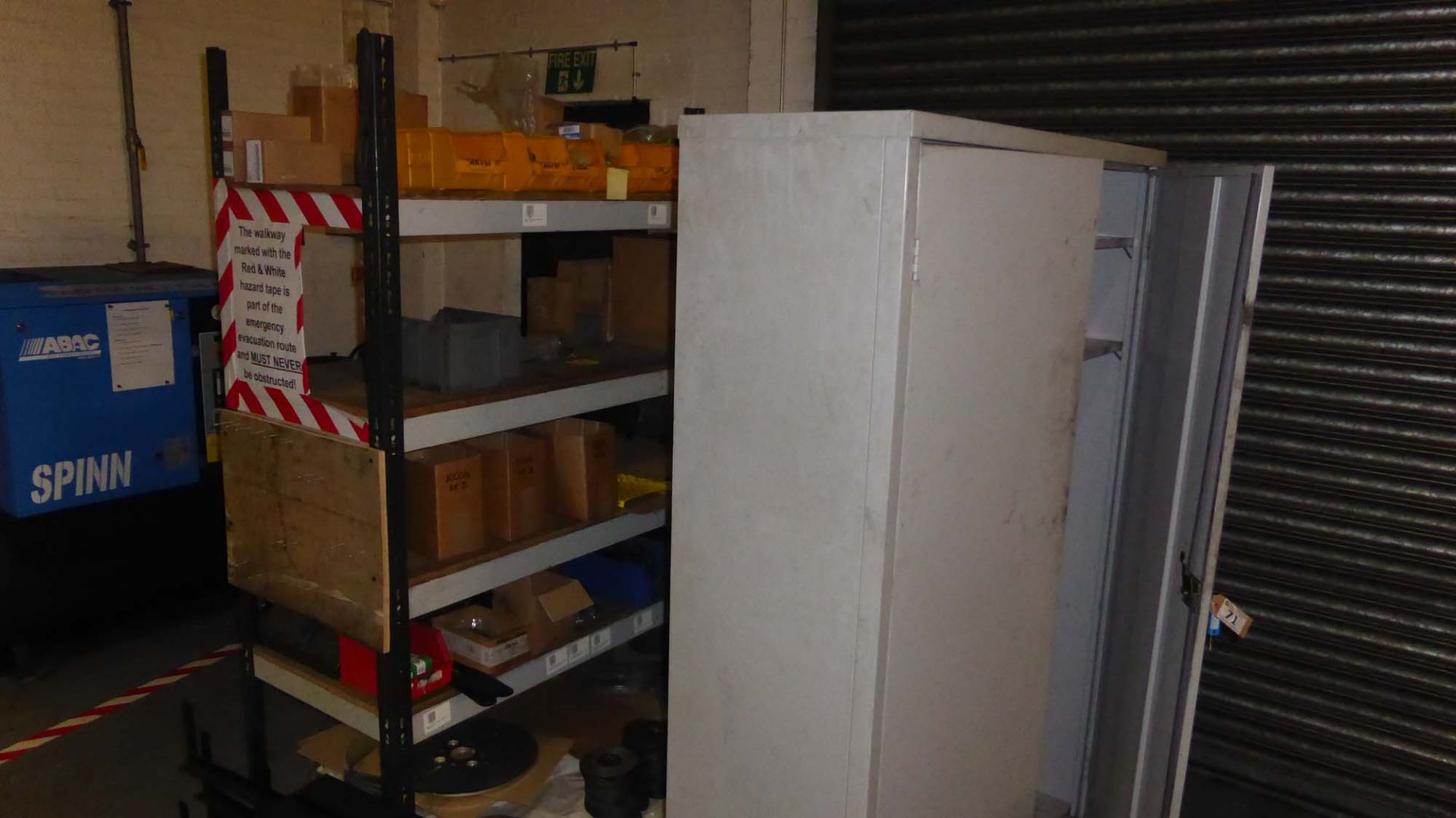 Grey steel double door stock cabinet and a brown and cream 4 shelf rack (not including contents)