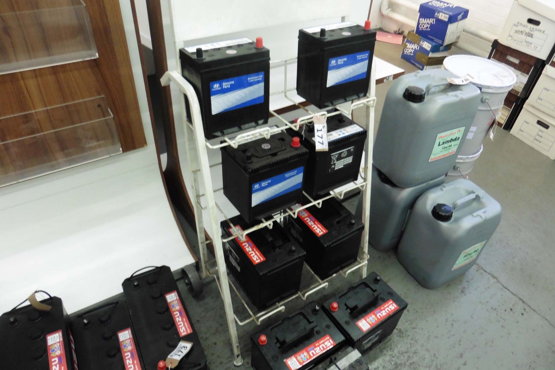 Rack containing 9 various Isuzu and other vehicle 12v batteries - Image 2 of 4