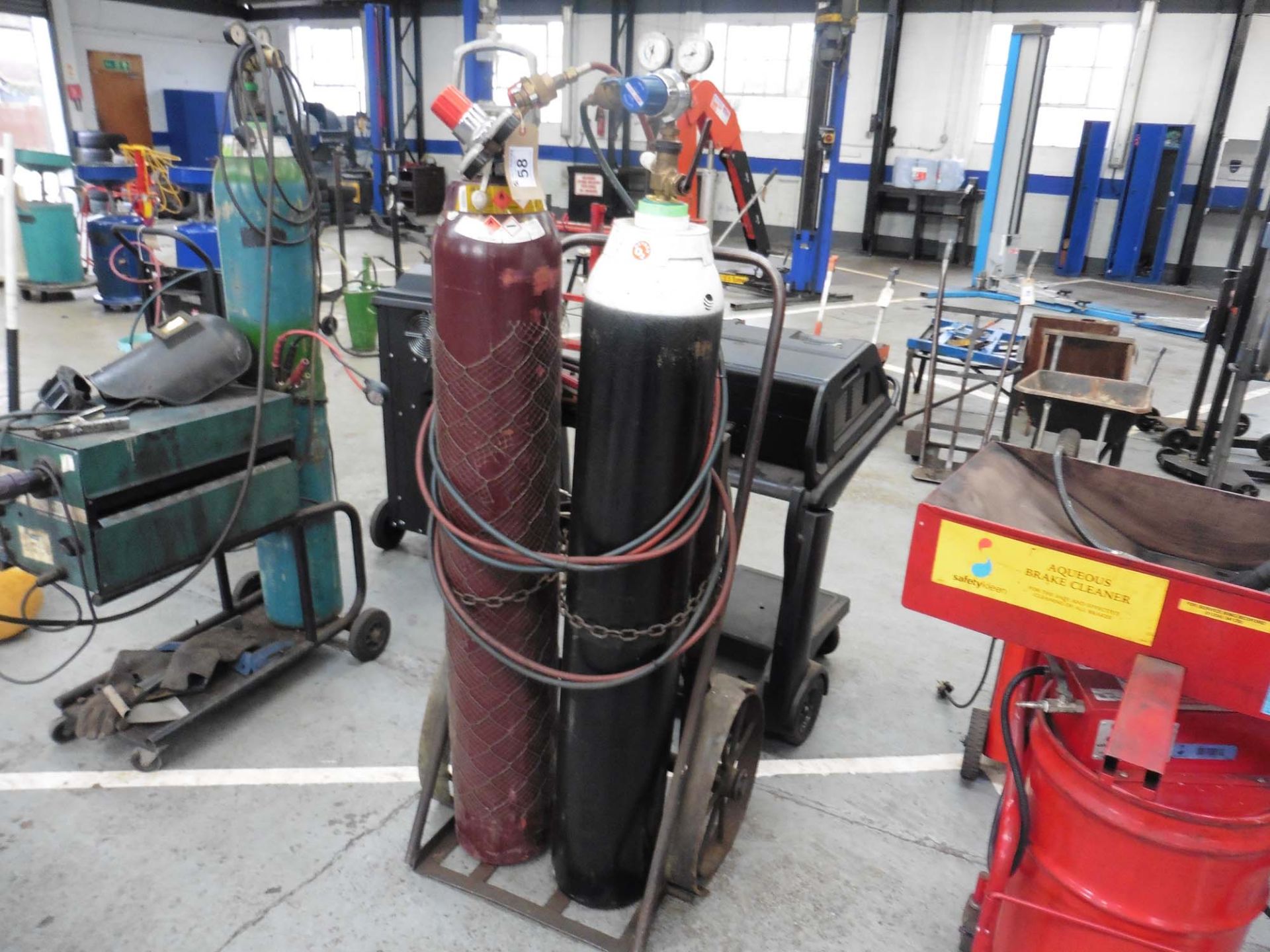 Set of oxy acetylene welding gauges, hoses and guns on trolley (bottles excluded)