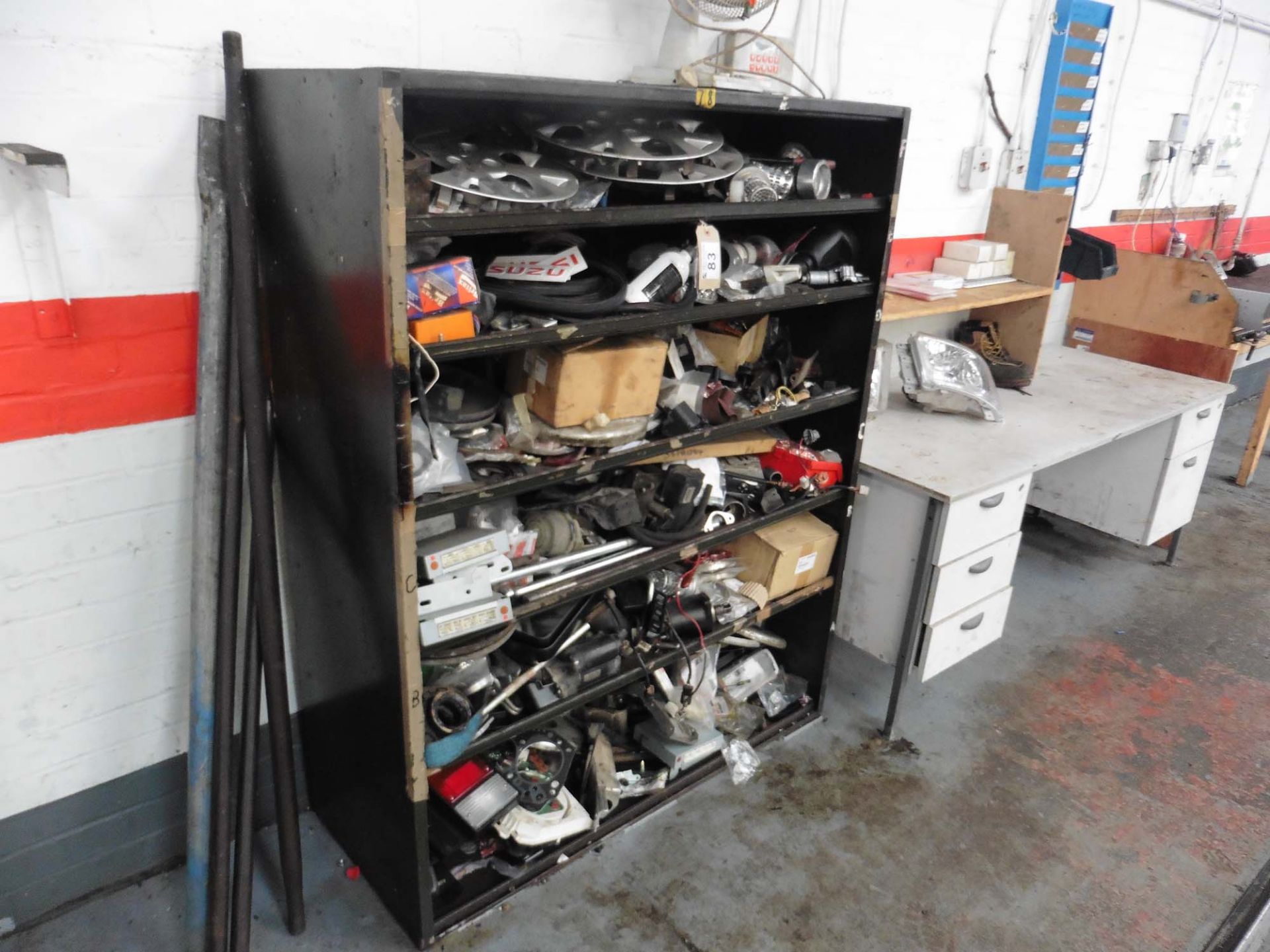 Rack containing misc. car spares, parts and sundries