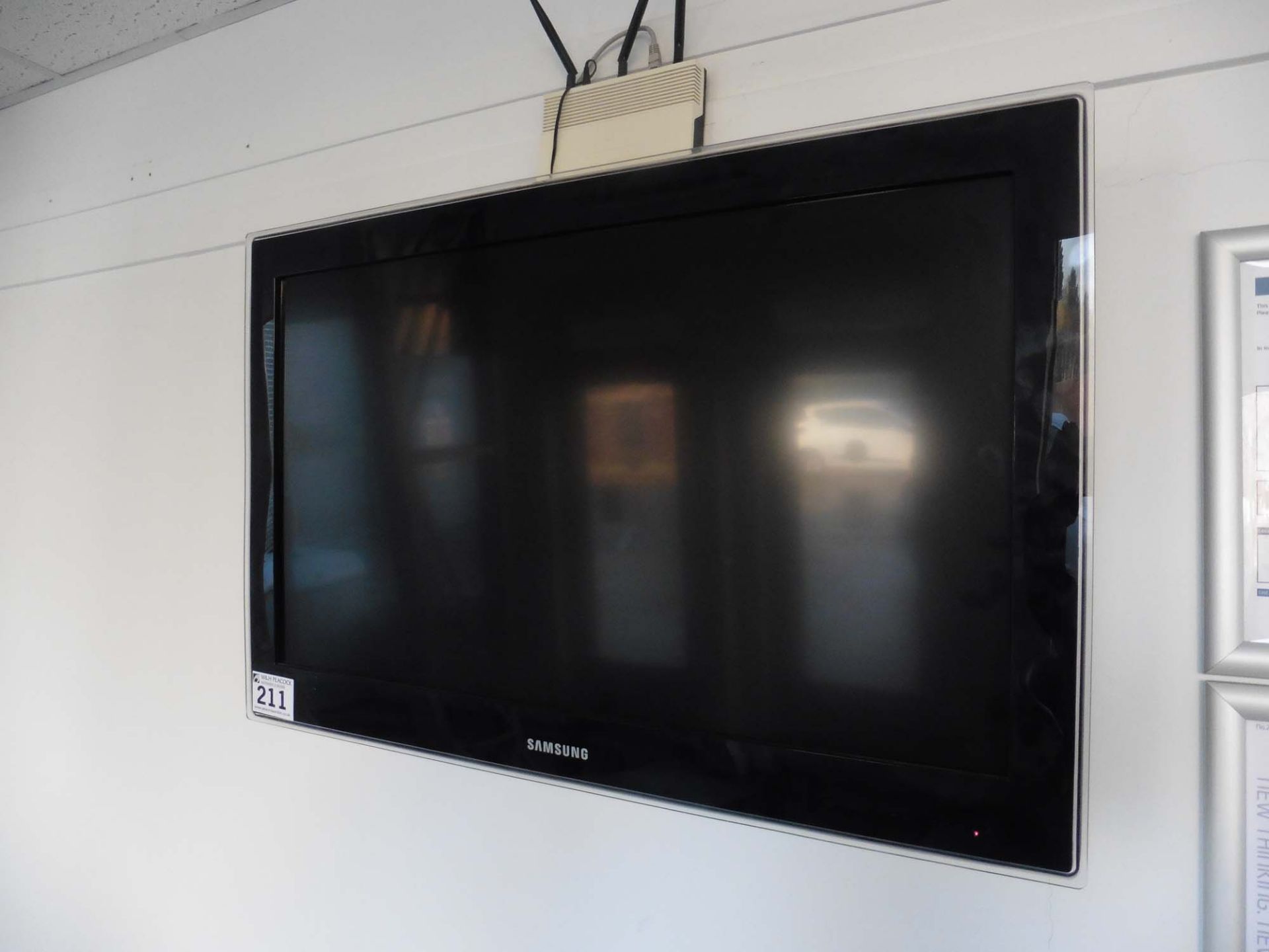 Samsung flat screen TV on wall bracket