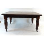A late 19th century mahogany extending dining table, with two fitted leaves,