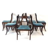 A set of seven William IV mahogany reeded dining chairs, the back rests with swag detail,