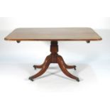 A 19th century mahogany supper table, the rectangular tilt-top over a turned column and four legs,