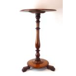 A 19th century mahogany occasional table, the circular surface on a turned support,