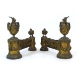 A pair of 19th century brass fire lions of Neo-Classical form decorated with urns and swags