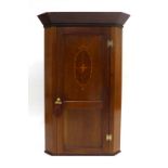 An Edwardian mahogany, strung and inlaid single door corner cabinet, w.