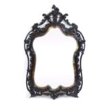 A 19th century wall mirror, the shaped and bevelled plate within a moulded foliate frame, h.