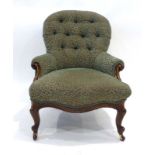 A Victorian mahogany and button upholstered nursing chair on scrolled front feet