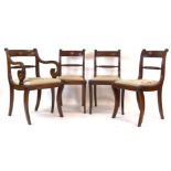 A set of four Regency mahogany framed dining chairs,