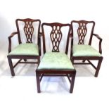 A reproduction set of six Chippendale-type mahogany dining chairs with drop-in seats,