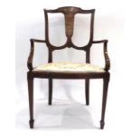 An Edwardian mahogany and marquetry salon chair on tapering legs