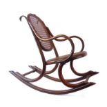 A child's bentwood and bergere rocking chair in the manner of Thonet