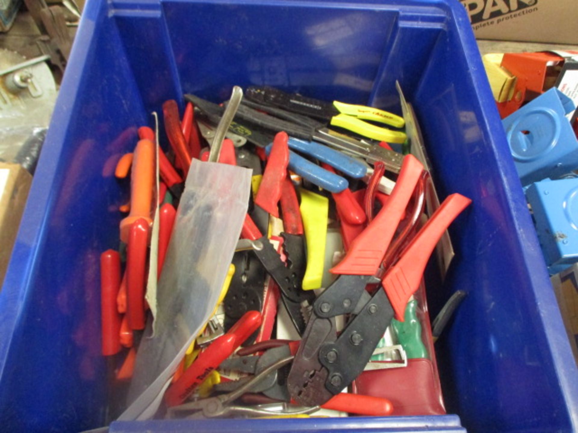 Plastic box of crimps and other hand tools